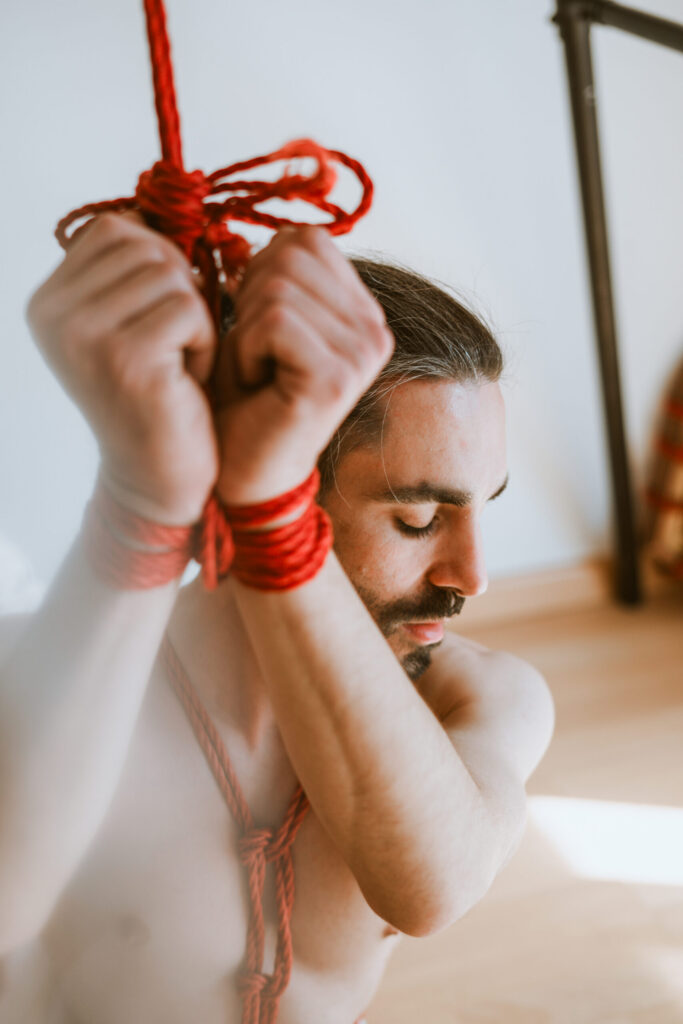 Intimate shibari session with male model