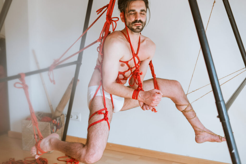 Intimate shibari session with male model