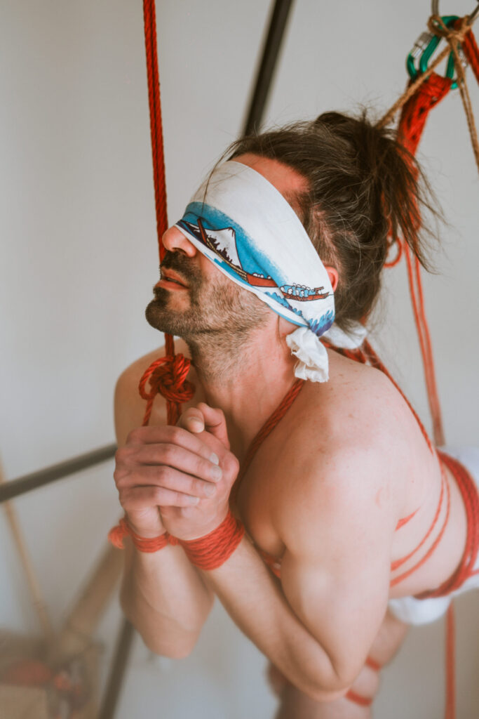 Intimate shibari session with male model